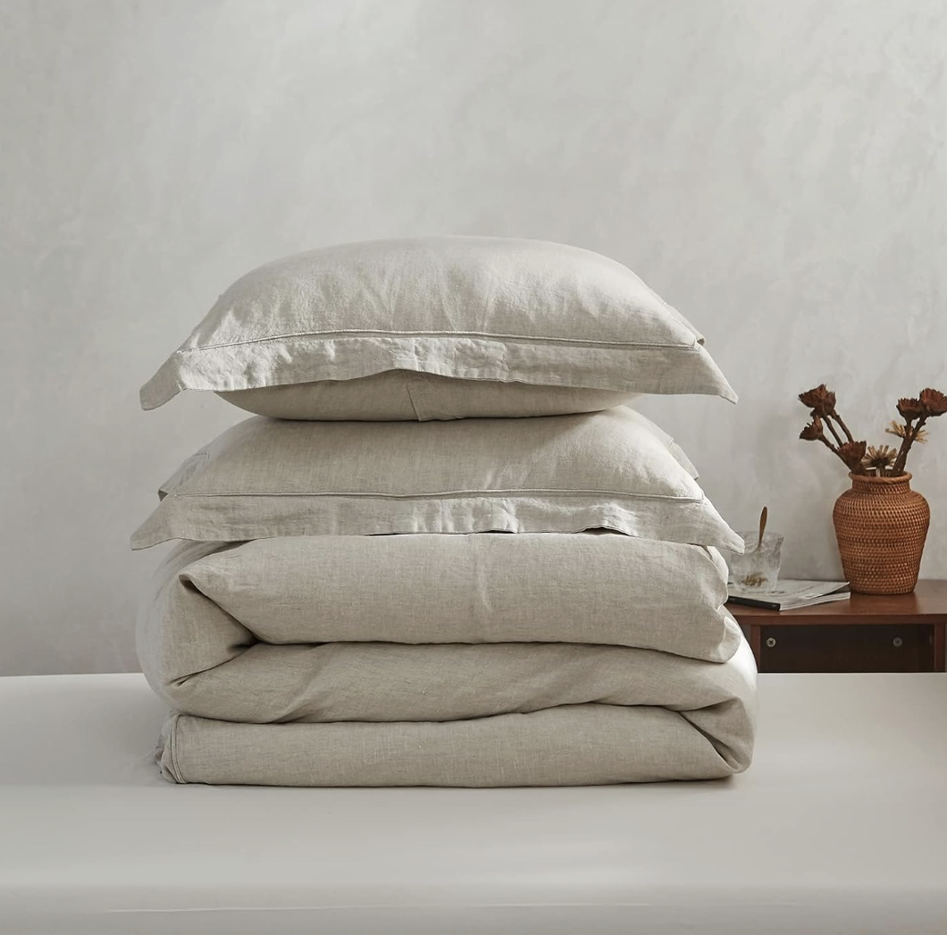 Layered washed linen bedding — natural texture, relaxed drape, and timeless craftsmanship