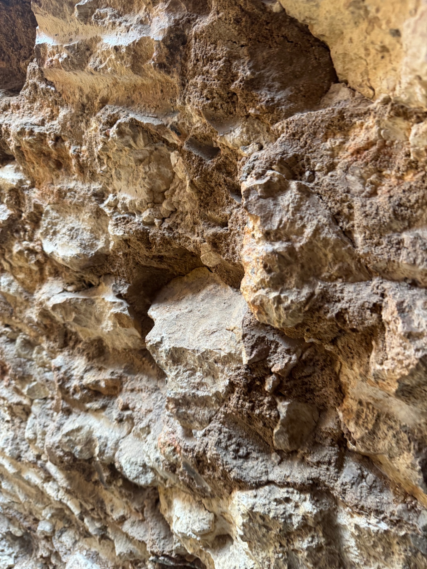 An intimate study of natural stone — texture, shadow, and weathering