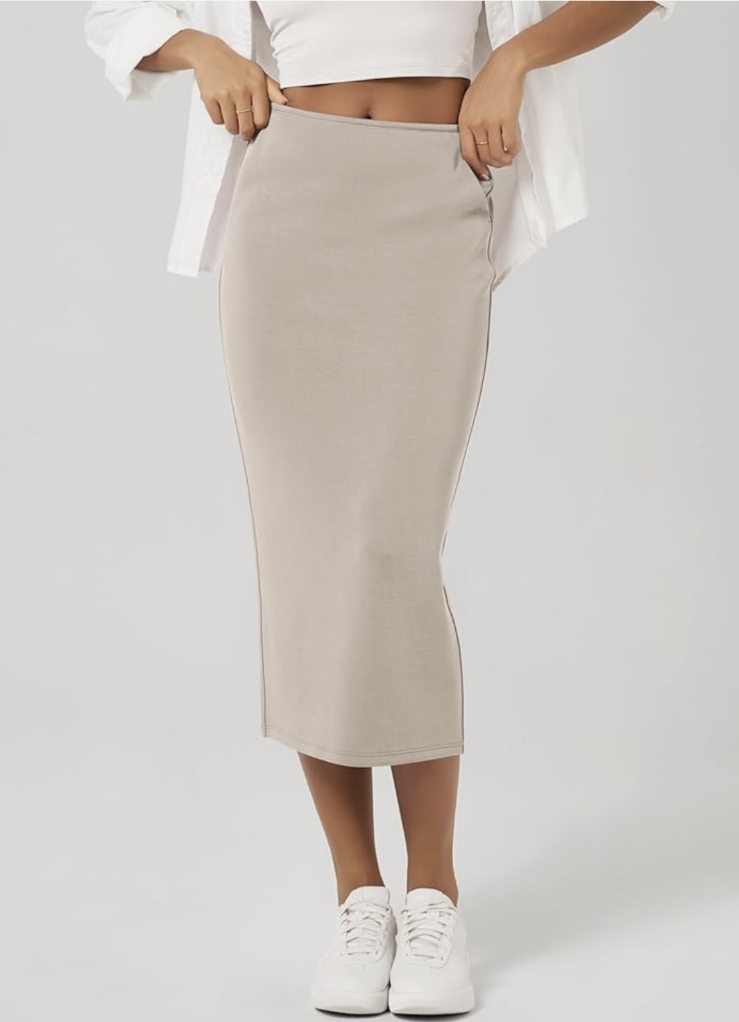 Flowing neutral beige midi skirt with A-line silhouette